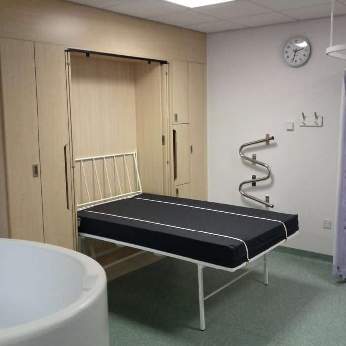 Bed open showing Straps and tubular steel Backrest